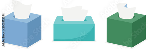 Three colorful tissue boxes with white tissues on a white background
