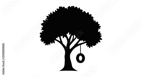Silhouette of a Tree with a Tire Swing