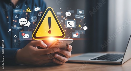 Person holding a smartphone displaying a warning sign with various social media icons smartphone awareness notification technology internet