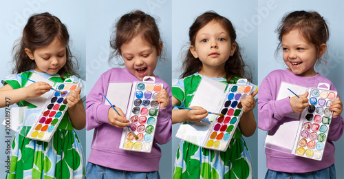 set of Little girl enjoying painting with brushes and a colorful watercolor palette on blue background