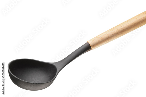 Фотография Black kitchen ladle with ergonomic wooden handle isolated on light background