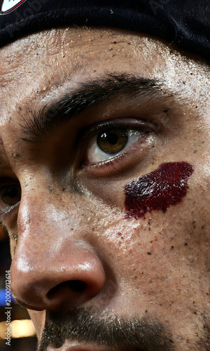 Close-up of male athlete showing determination and a bruise during NBA Finals  