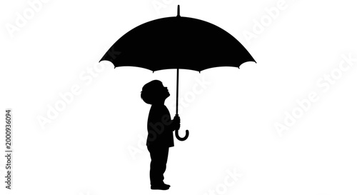 Silhouette of a small child holding a large umbrella.