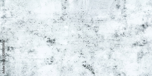 A frozen blue grunge wall background features a cold winter texture with ice frost patterns and fresh liquid bubbles trapped in a clean snow splash design