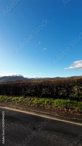 Scottish Rural Country road Hills Near Glasgow Scotland. Car Mounted Camera Footage During Drive Through Rural Area.
