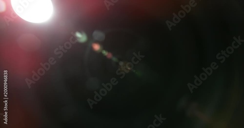 Slow motion cinematic lens flare and light leak effect isolated on black background. Perfect overlay for VFX, transitions, title reveals, film burn style and glow highlights.