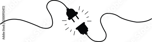 Black electrical plug and socket disconnected with sparks electricity power
