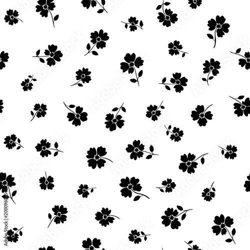 Seamless black and white floral pattern with small flower silhouettes