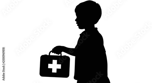 Silhouette of a young child holding a medical first aid kit.
