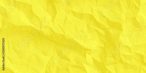 Crumpled yellow paper texture background, vibrant wrinkled parchment surface for copy space. high-quality, macro shot of a vibrant yellow crumpled paper surface.