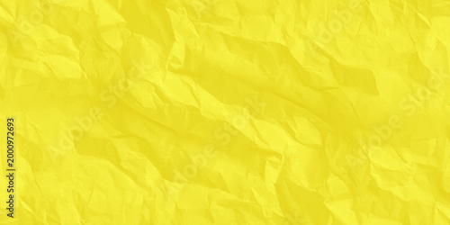 Crumpled yellow paper texture background, vibrant wrinkled parchment surface for copy space. high-quality, macro shot of a vibrant yellow crumpled paper surface.