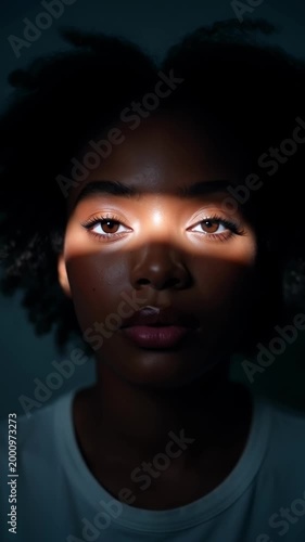 Shifting light patterns on face: emotional journey of shadows and expressions