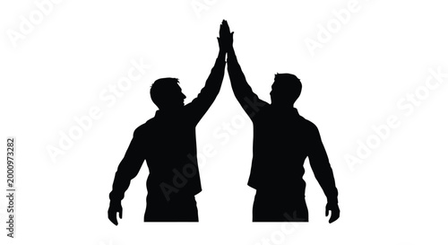Two men giving a high five silhouette