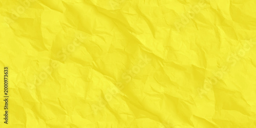 Crumpled yellow paper texture background, vibrant wrinkled parchment surface for copy space. high-quality, macro shot of a vibrant yellow crumpled paper surface.