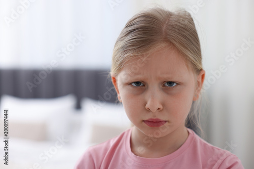 Принти на полотні Portrait of resentful little girl at home, space for text