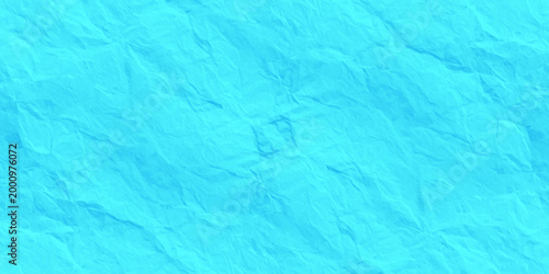 Cyan blue crumpled paper texture background, abstract wrinkled turquoise fabric material, top view textured surface