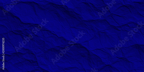 Dark navy blue crumpled paper texture, abstract wrinkled midnight fabric background, deep indigo textured relief surface. dark blue abstract background featuring deep wrinkles and folds.