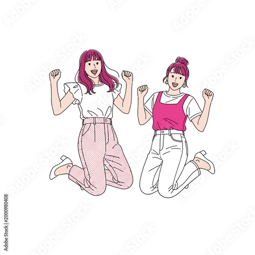 Two women celebrating with fists raised in joyful expressions outdoors