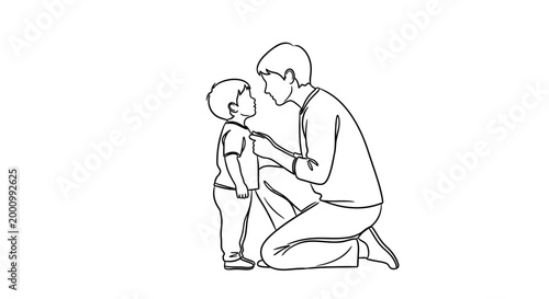Father crouching and talking to his young son.