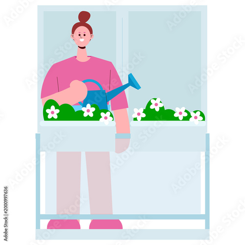 Young woman watering flowers on balcony