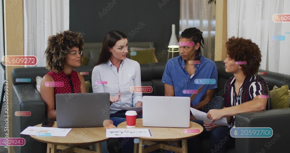 Fototapeta premium Leading woman wearing white button-down gesturing and guiding meeting in lounge, with two laptops