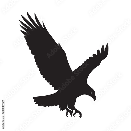 Black silhouette of a majestic eagle or hawk bird of prey in flight with wings spread and talons out