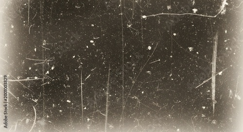 Faded old photo texture with film grain sepia dust and irregular scratched marks artistic overlay
