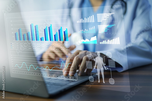 Doctor analyzing medical data with futuristic interface, healthcare analytics and digital transformation concept.