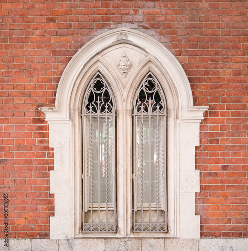 a window with a large-scale image of an arch
