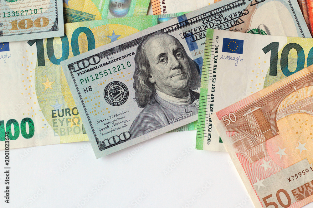 Obraz premium American dollar banknotes designed on white surface with Euro banknotes and copy space