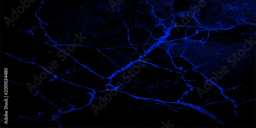 Dark and luminous, the image presents an interplay of shadows and glowing neon blue lines, evoking a sense of mystery and modernism.