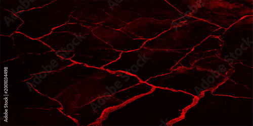 A striking close-up showcases a dark surface, intricately webbed with a network of vibrant red cracks, creating a visual symphony of texture and contrast.
