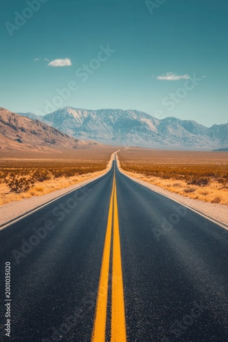 Endless Desert Road Leading to Majestic Mountains