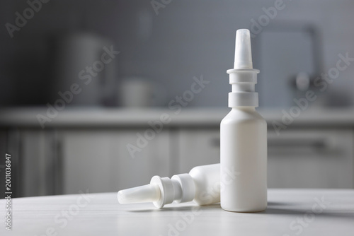 Closeup Of Nasal Spray With Tissues. Bright Blue Background Showcases Nasal Spray Product With Tissues