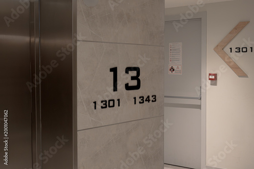 Modern Hotel Corridor Signage with Floor 13 Indicator