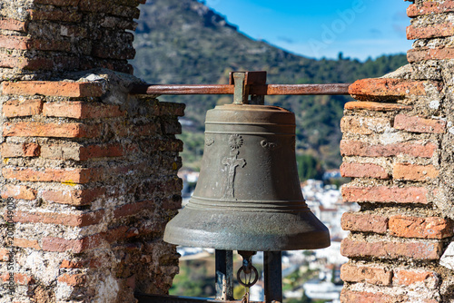 Bell at old castle Castillo del Aguila at white town Gaucín, Málaga province, Spain