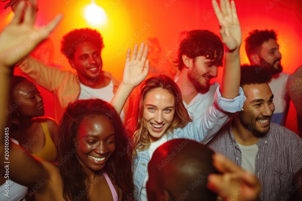 Fototapeta premium Mixed group dancing and celebrating on crowded dance floor