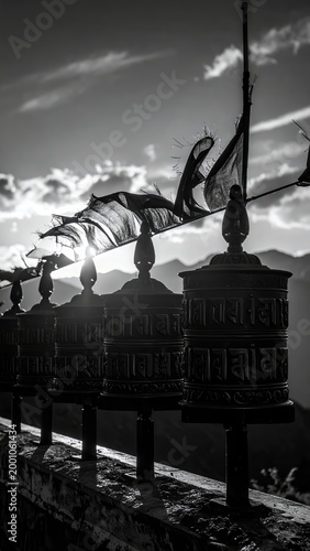 Mystical monochrome: Prayer wheels and wind-blown flags in the Himalayan backlight