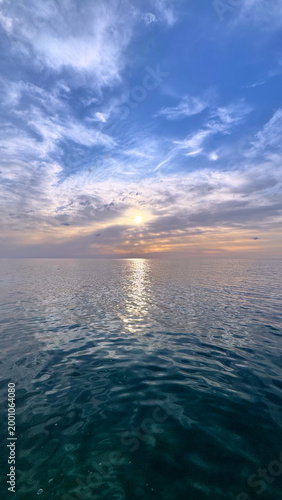Adriatic Sea reflecting golden sunset over calm waters along Montenegro coast