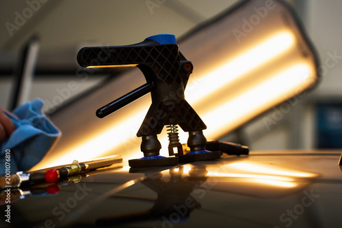 Photos Dynamic glue pulling with a specialized dent lifter gently reverses collision damage from the automotive pillar