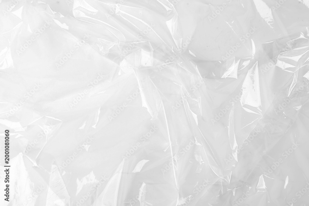 Obraz premium Transparent plastic wrap on white background, top view