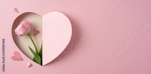 Happy Mother's Day pink tulip in heart-shaped gift card on soft pastel background