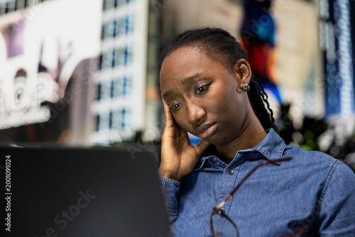Photography Watching depressing TV show, laptop and sad woman seeing episode on streaming services on park bench