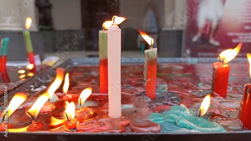 Obraz na plátně Burning candles in church, San Expedito, Balvanera, Buenos Aires