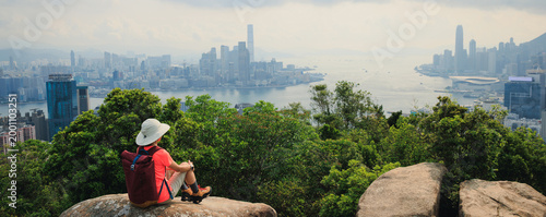Canvas Print Woman hiking on mountain top in Hong Kong