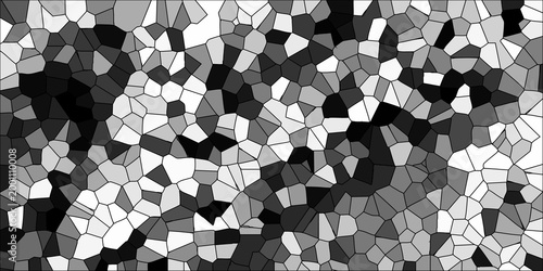 Vibrant grayscale mosaic background with a dense arrangement of irregular polygons in contrasting shades of black white and gray for graphic design