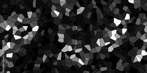 Dark abstract geometric mosaic with deep gray and black tones interspersed with bright white and light gray polygons for a dramatic textured background