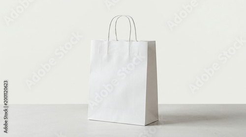 White paper shopping bag on table.