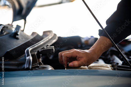 Obraz na plátne Close up Car Mechanic man hands repairing car auto repair shop