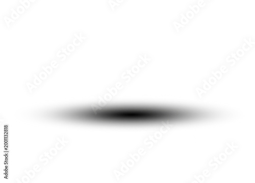 A dark circular shadow falls on a surface with a subtle gradient effect.